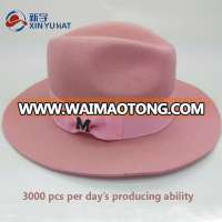 female pink wool felt homburg hat with decorative ribbon